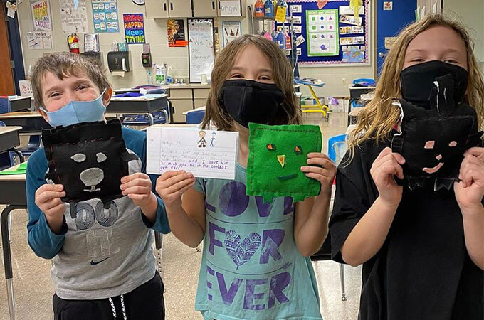 teach kids about community by getting them to sew a softie to giveaway