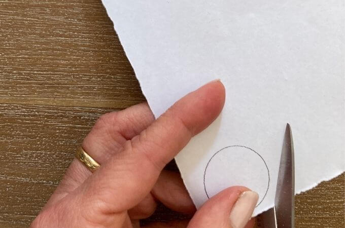 cutting a around a circle grawn on paper