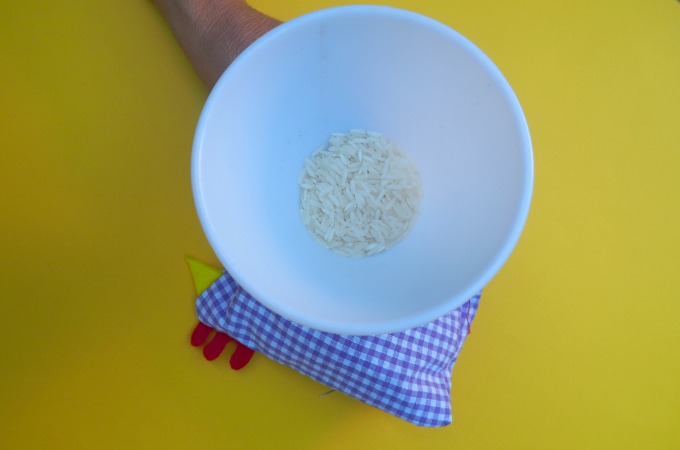 Filling a soft toy with rice