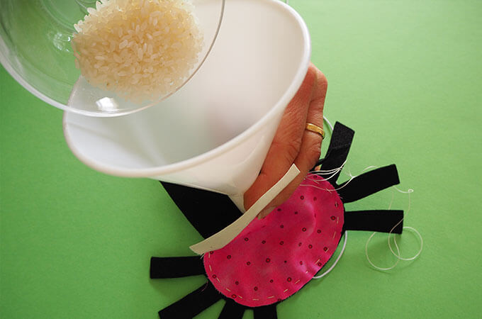 putting weighting material into a spider softie