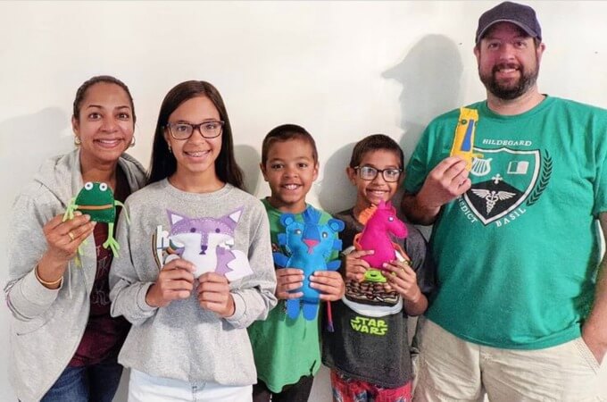 family sewing softies together