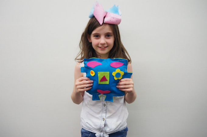 Kids sew a softie for kids in a shelter